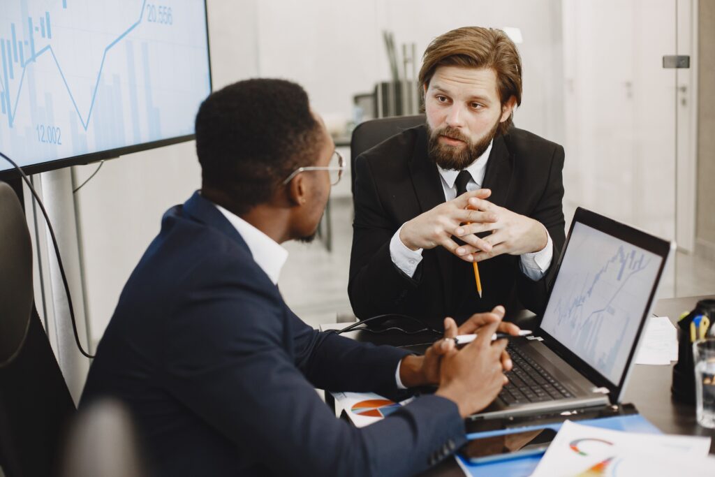 Consultant talking to business man