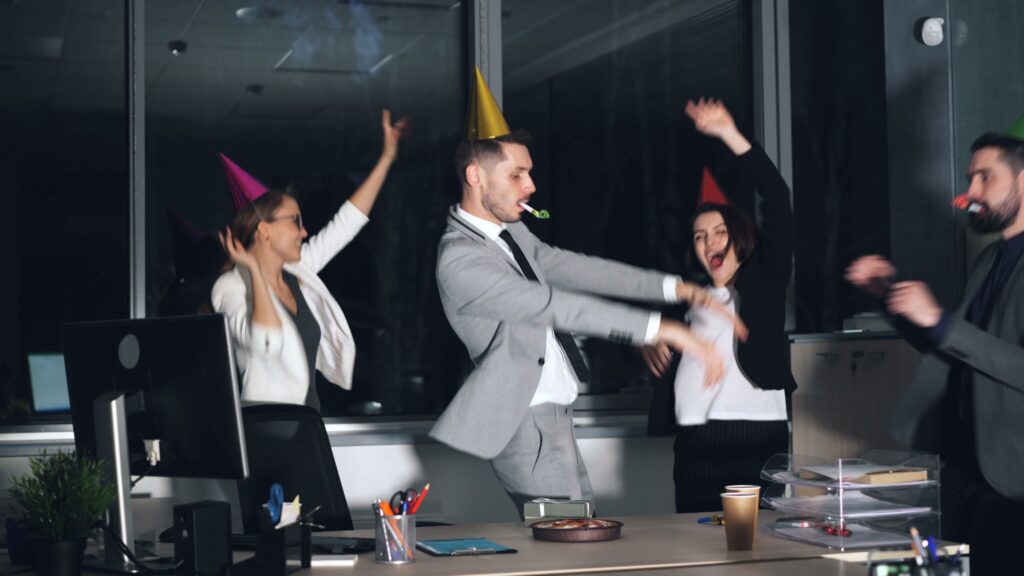 four people at an Office party